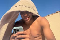 Mbappe spotted carrying girlfriend's dresses during holiday