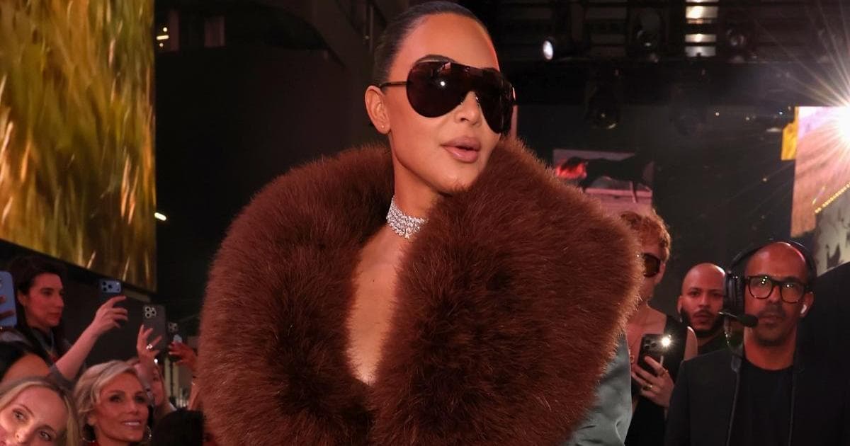 Kim Kardashian’s Plunging Top Is Pure Saint Laurent by Tom Ford Heat