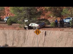 Police: Driver arrested after crash leaves car teetering on edge of steep embankment in St. George