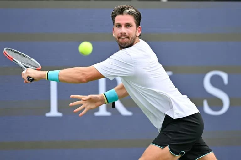 Battling Norrie survives match point to oust de Minaur