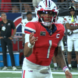 Fifita sets passing record, Wildcats race past Northern Illinois 42-17