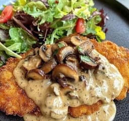 Crispy Chicken Schnitzel with Creamy Mushroom Sauce and Fresh Salad
