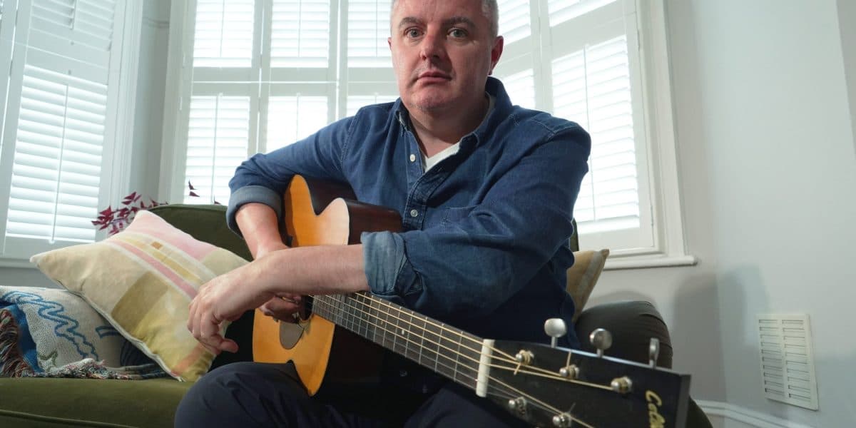 AI is polarizing musicians. This 49-year-old guitarist used it to keep playing when he got Parkinson's