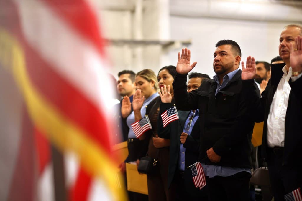 Aboard Alameda's USS Hornet, 76 immigrants become ...