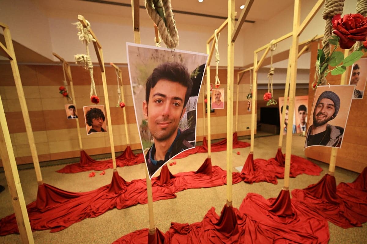 'Shame on you': Crowds of Iranians protest as regime hangs its young