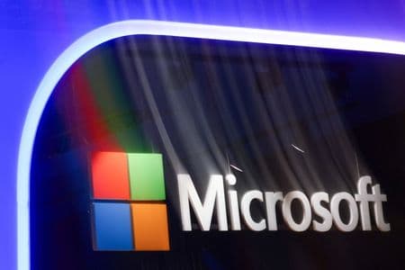 Microsoft restructures and raises prices to fund AI investments