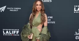 Jennifer Lopez’s Plunging Bronx Banco Gown Has Bold Cutouts & Sky-High Slits