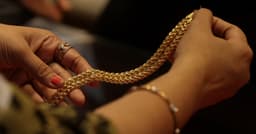 Gold dips as inflation concerns linger; markets watch US-Iran talks | Reuters