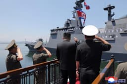 North Korea's Kim unveils plans for 10000-tonne warships ...