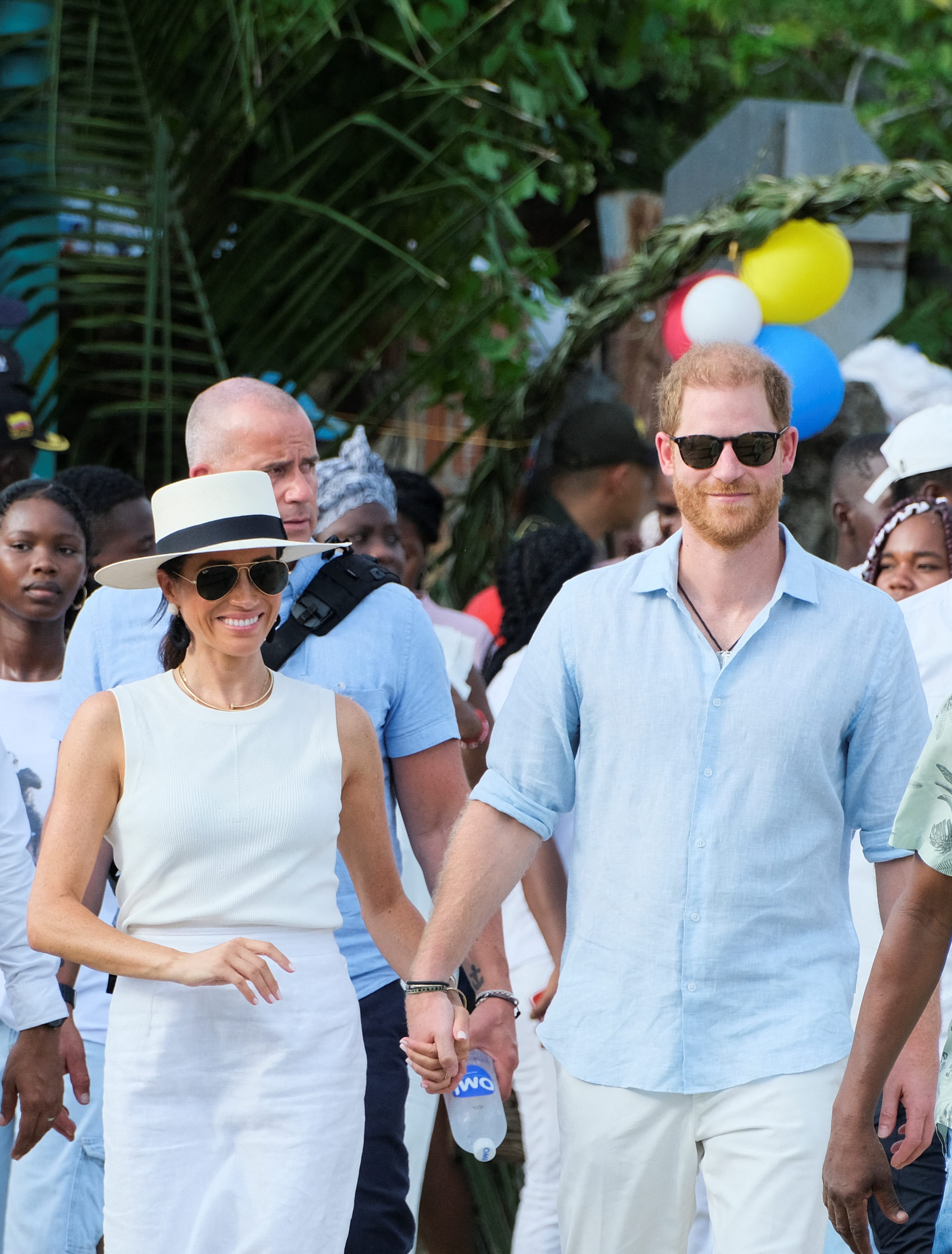 Fresh Lawsuit Hangs Over Harry and Meghan as They Head Down Under