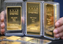 Gold Eases from Two-week High as Firmer US Dollar Weighs