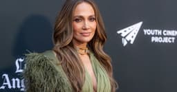 Jennifer Lopez Wears a Plunging Dress With So Many Cut-Outs It’s Barely Holding Together