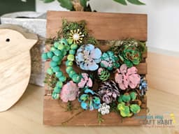 Dollar Store Mini Pallet Craft: DIY Pinecone Succulent Decor