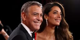 Amal Clooney is timeless in a red gown and dangling diamonds at the Golden Globes