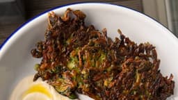 zucchini fritters with whipped tahini - by Susanna Bowers