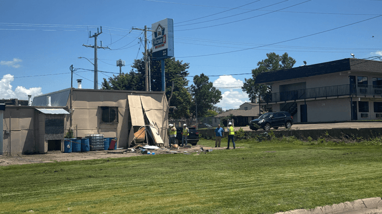 Vehicle crashes through building in West Topeka