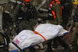 Israeli authorities recover bodies from building hit by Iranian missile | AP News