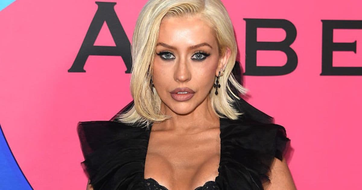 Christina Aguilera Lets Her Lingerie Peek from Deeply Plunging Top