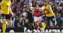 Arsenal roars back to beat Leeds 2-1 as Calafiori and ...