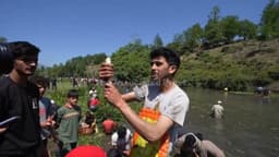 Village festival combines catching fish with clearing weeds and silt