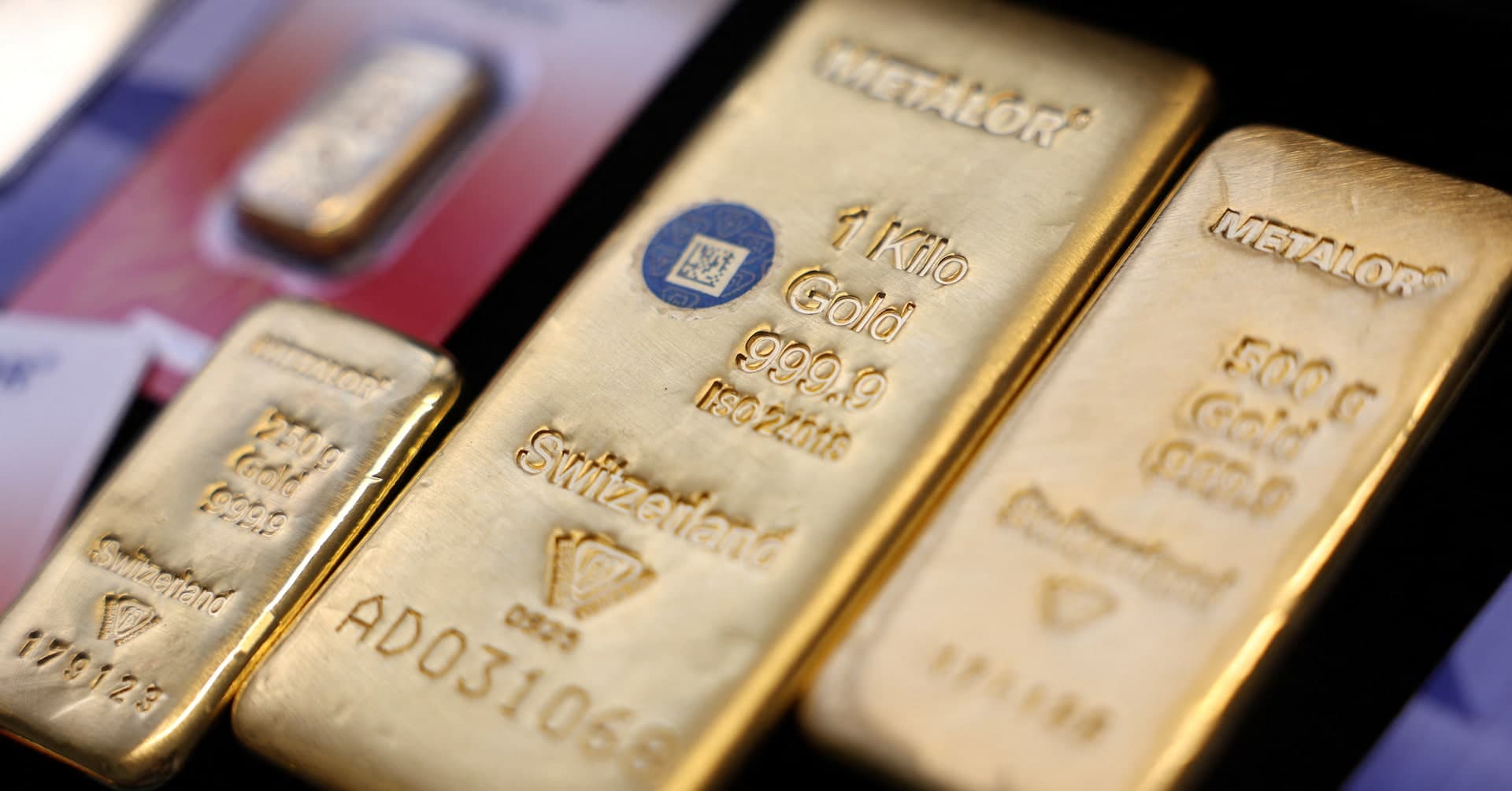 Gold trades near two-week high on cooling US rate-hike bets | Reuters